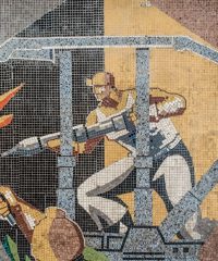 Detail of a large mosaic panel by artist Ladislau Schmidt on the interior wall in administrative building at Petrila Coal Mine.